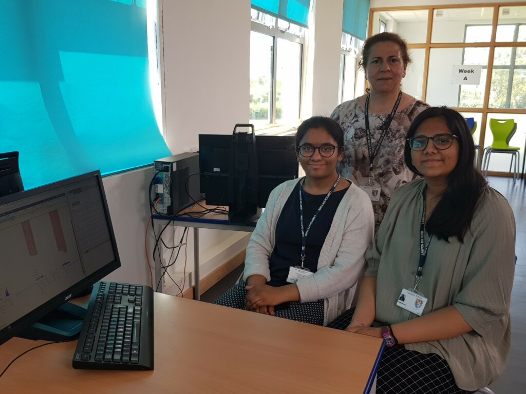 Left to right: Lavanya and Advika with their tacher Razika from Lampton School contributed annotations of the human whipworm genome