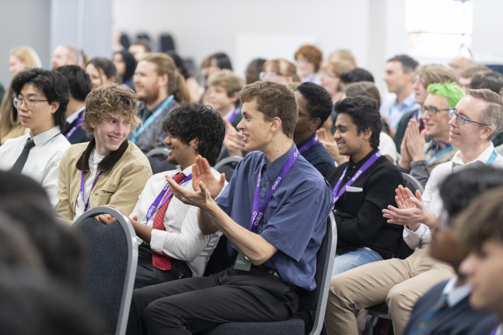 A crowd of students clapping