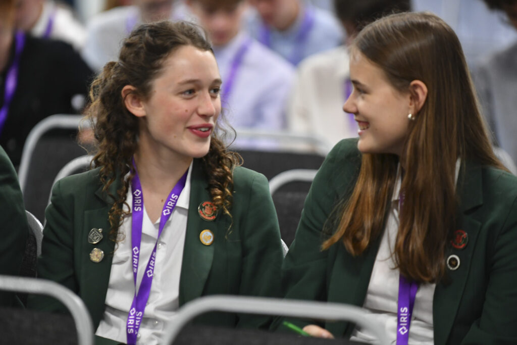 Two girls talking at the Exeter conference