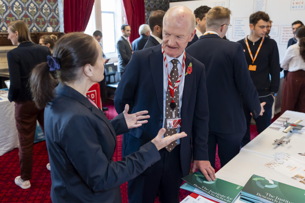 Members of IRIS speaking to Lord Willets in Parliament